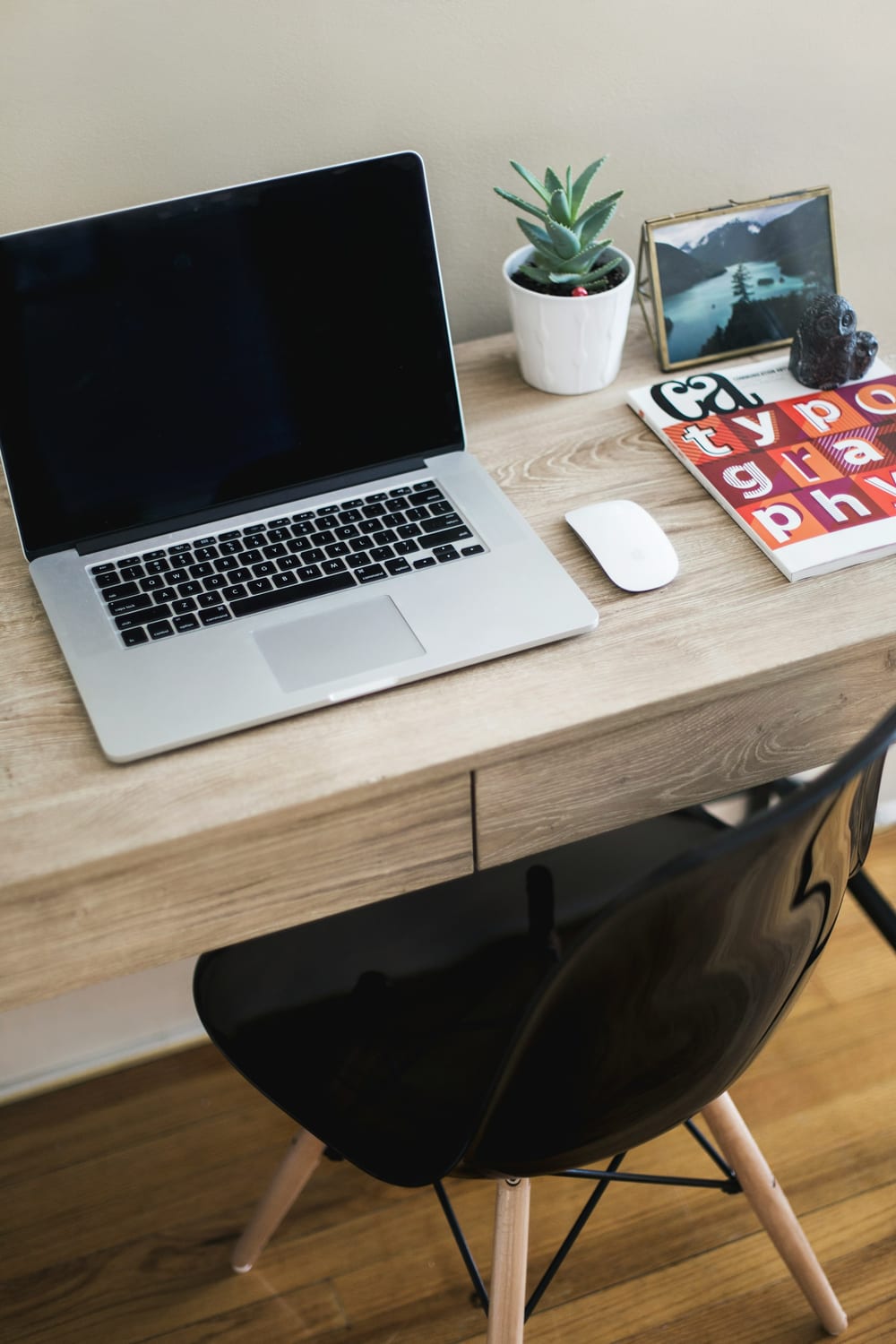 A refurbished laptop set up on a clean, bright desk.